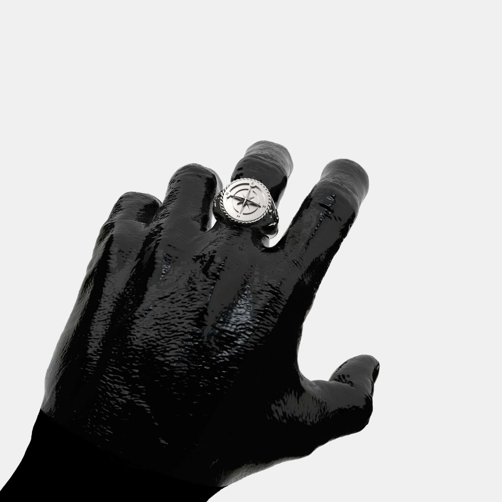 Elegant Coordinates Silver Ring displayed on a black hand, showcasing its unique design and craftsmanship.