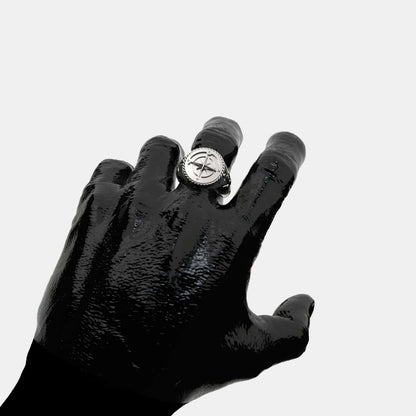 Elegant Coordinates Silver Ring displayed on a black hand, showcasing its unique design and craftsmanship.